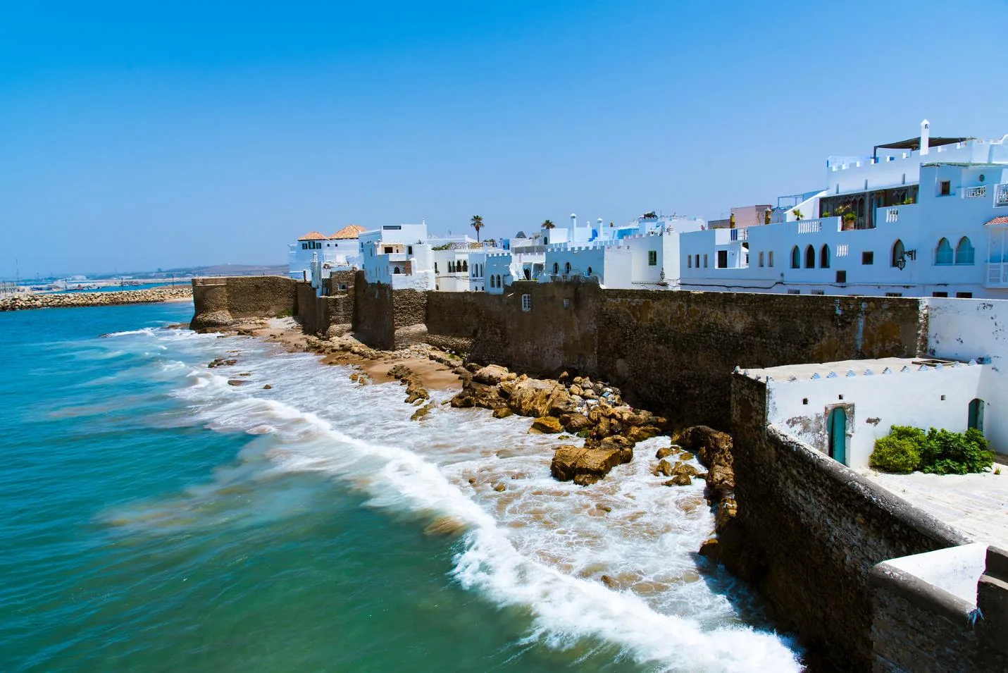 Painted murals on the whitewashed walls of Asilah