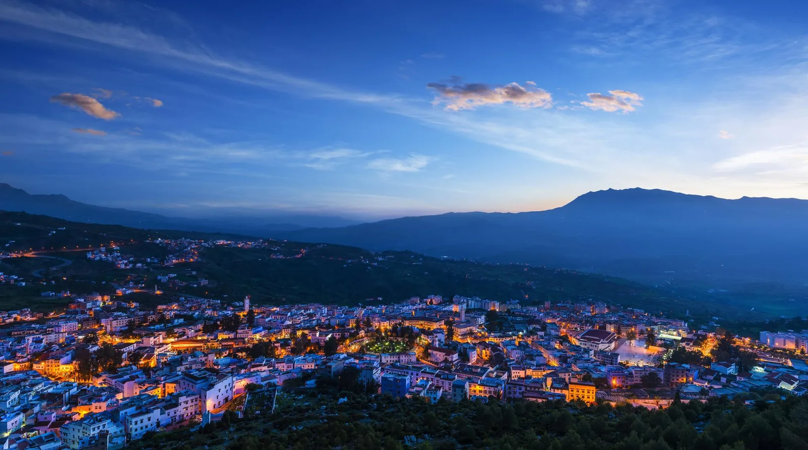 Chefchaouen rooftops below the Rif mountains